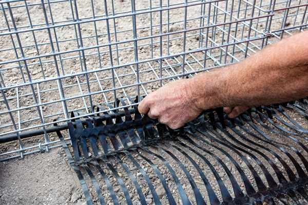 Gewapende grondconstructie met Tensar RE grid en schandkorf in primaire waterkering